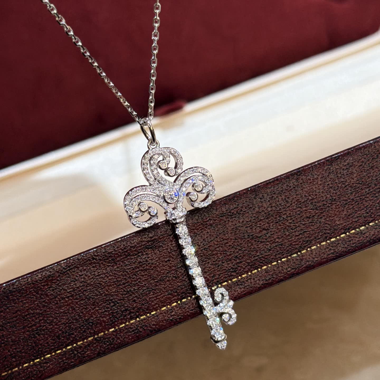 Tiffany & Co Elegant Silver Key Pendant with Diamonds